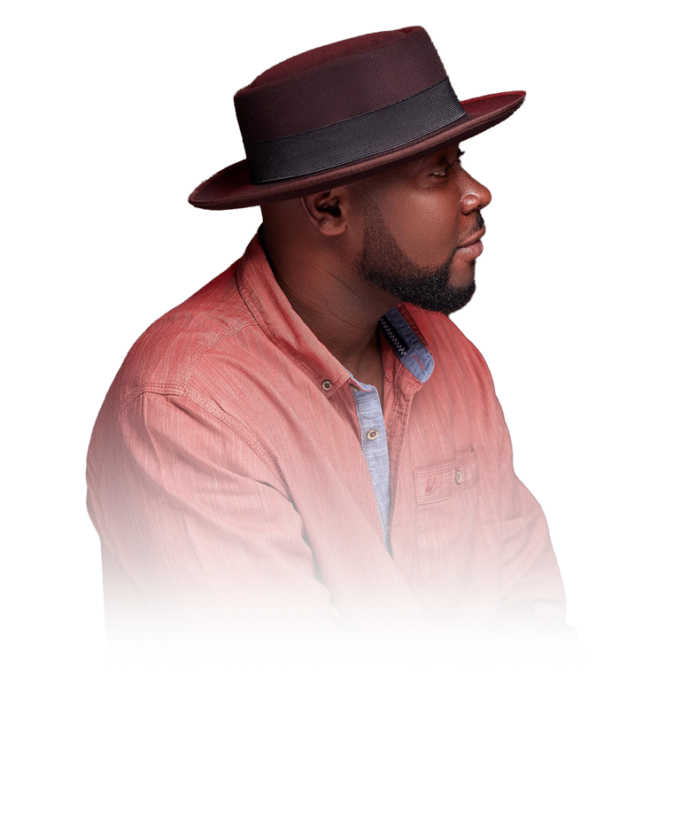 Emmanuel Tsekpo in profile, wearing a wide-brim hat.