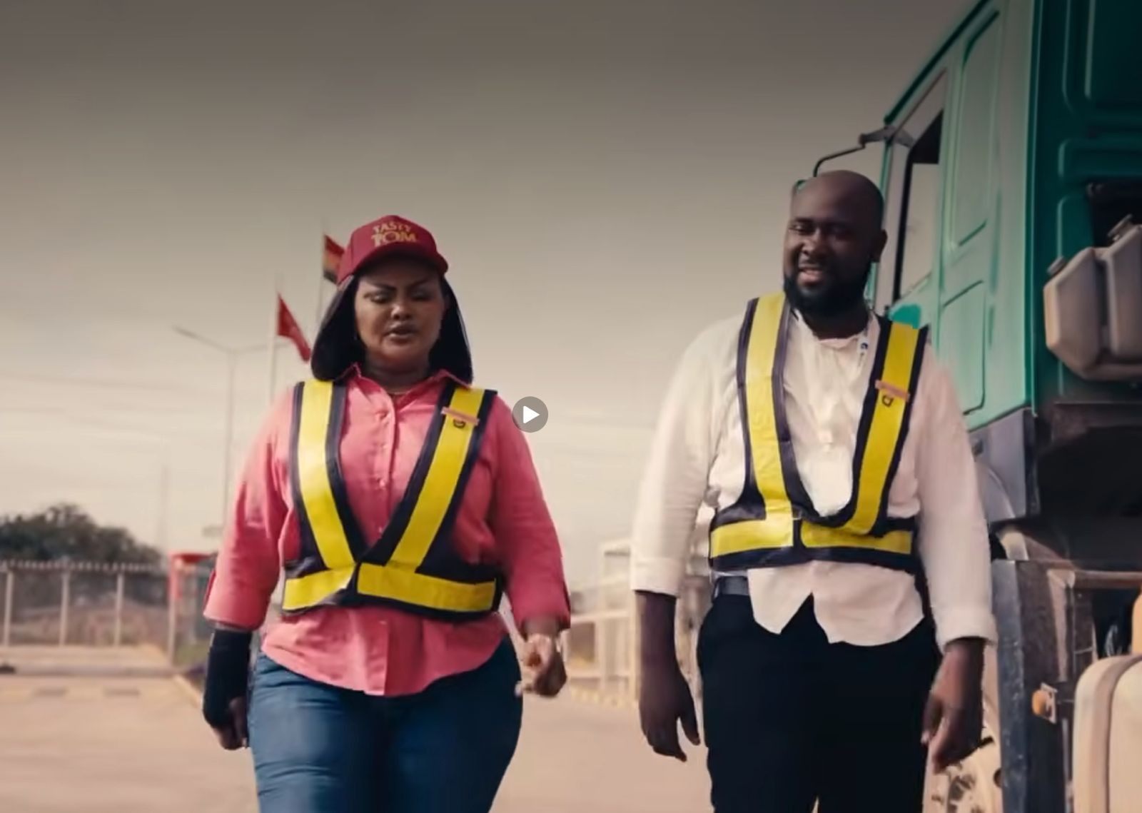 Tasty Tom campaign video still, two brand ambassadors walking beside a delivery truck.